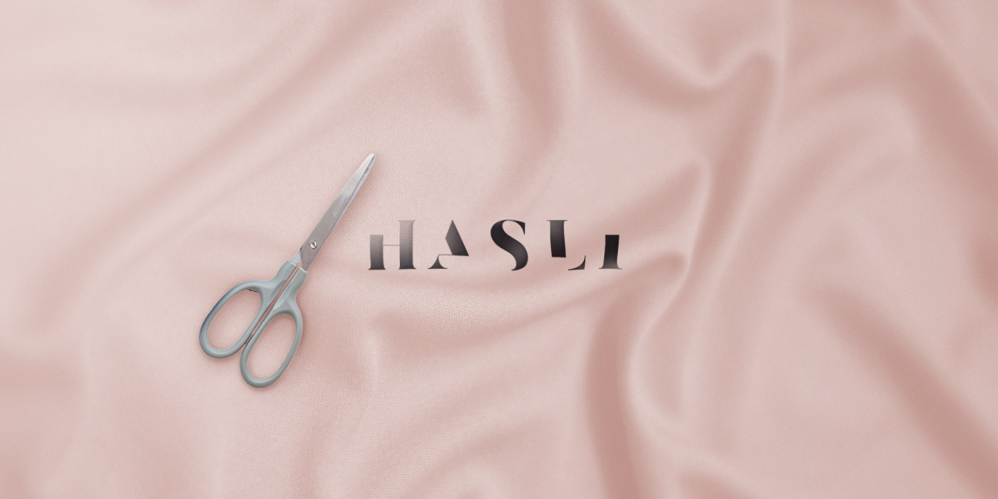 The wordmark — incomplete by design, finished by the customer, just like every piece of clothing.