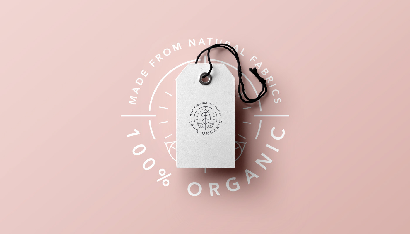 The organic stamp on the clothing tag — the eco story made tangible.