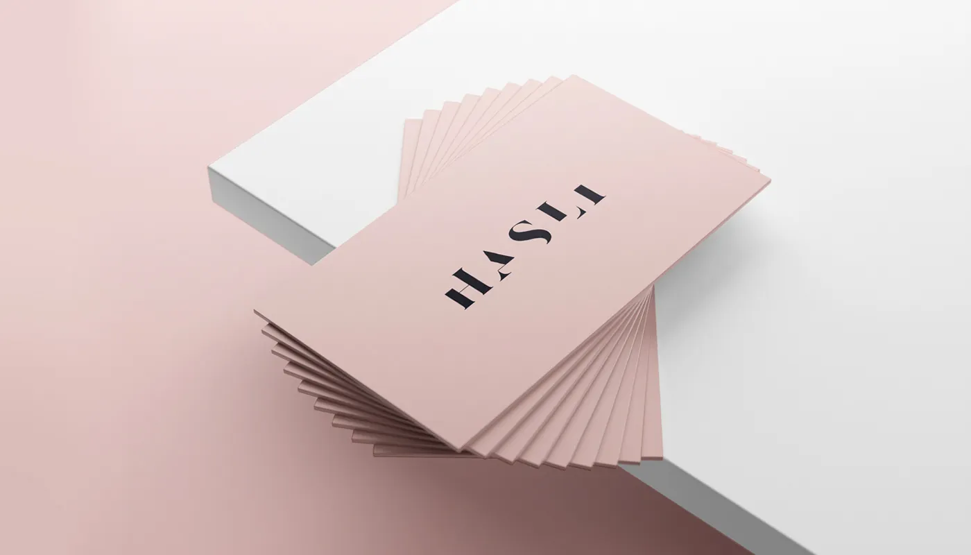Business cards — the wordmark living on premium, tactile stock.
