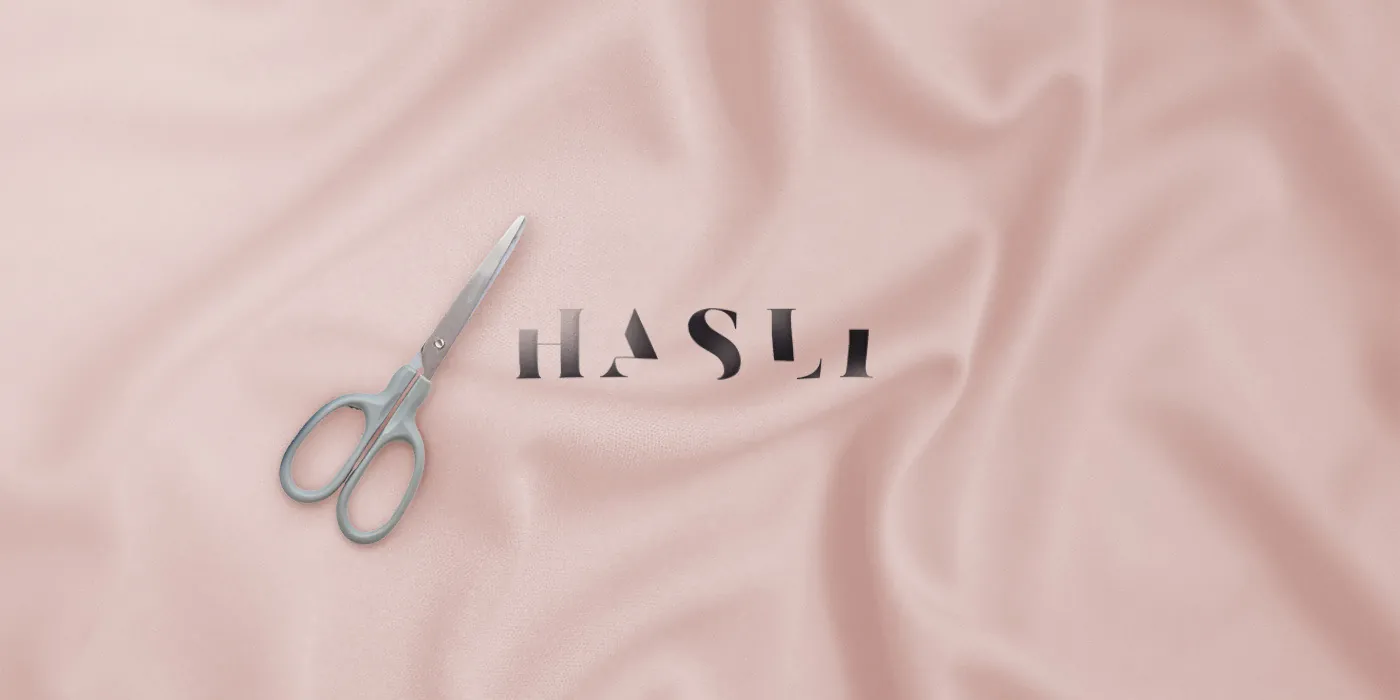 The wordmark — incomplete by design, finished by the customer, just like every piece of clothing.